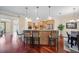 Modern kitchen with counter seating, stainless steel appliances, and custom cabinetry at 11729 Newberry Grove Loop, Riverview, FL 33579