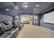 Fully equipped media room with comfortable seating, large screen, and access to the game room at 11729 Newberry Grove Loop, Riverview, FL 33579