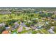 An aerial view of a neighborhood with a golf course, swimming pools, and lush greenery at 12156 Meadowbrook Ln, Largo, FL 33774