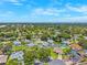 An aerial view showcasing the neighborhood's layout and nearby amenities with many back yard swimming pools at 12156 Meadowbrook Ln, Largo, FL 33774