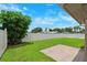 Well-maintained backyard featuring lush green grass, privacy fence, and shade trees for outdoor enjoyment at 12156 Meadowbrook Ln, Largo, FL 33774