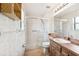 Bathroom featuring updated walk-in shower, and wood-look vanity at 12156 Meadowbrook Ln, Largo, FL 33774