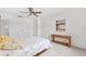 Comfortable bedroom with neutral carpet, double closet doors, and a wall-mounted mirror at 12156 Meadowbrook Ln, Largo, FL 33774
