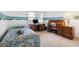 Bedroom features a twin bed, desk, and carpeted flooring at 12156 Meadowbrook Ln, Largo, FL 33774