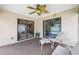 Inviting screened lanai with neutral seating and a ceiling fan for outdoor relaxation and entertaining at 12156 Meadowbrook Ln, Largo, FL 33774