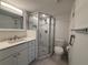 Modern bathroom featuring a tiled walk-in shower, sleek vanity, and updated fixtures at 12300 Vonn Rd # 9105, Largo, FL 33774
