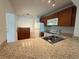 Functional kitchen features granite countertops, ample cabinetry, and white appliances at 12300 Vonn Rd # 9105, Largo, FL 33774