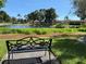 Relax by the picturesque pond with park benches, lush greenery, serene setting for nature lovers at 12300 Vonn Rd # 9105, Largo, FL 33774