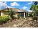 Well-maintained backyard with thriving garden, screen enclosure, and ample space for outdoor relaxation at 12411 Talpa St, Spring Hill, FL 34608