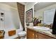 Bathroom with decorative shower curtain, decorative art, decorative counter, and sink at 12411 Talpa St, Spring Hill, FL 34608