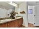Double sinks and granite countertops complete this stunning bathroom at 12411 Talpa St, Spring Hill, FL 34608