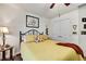 Bedroom with closet, queen bed, and side table at 12411 Talpa St, Spring Hill, FL 34608