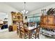 Cozy dining room showcasing a rustic table setting and warm lighting at 12411 Talpa St, Spring Hill, FL 34608
