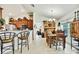Stylish dining area featuring vaulted ceilings and a view into the kitchen at 12411 Talpa St, Spring Hill, FL 34608