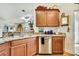 Bright kitchen offers stainless appliances, granite counters and wood cabinets at 12411 Talpa St, Spring Hill, FL 34608
