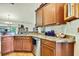 Kitchen features stainless appliances, granite counters and hardwood flooring at 12411 Talpa St, Spring Hill, FL 34608