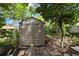 Durable storage shed with double doors, offering ample space for gardening tools and outdoor equipment at 12411 Talpa St, Spring Hill, FL 34608