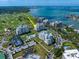 Aerial view of luxury waterfront condo complex with golf course and water views at 125 Belleview Blvd # 503, Belleair, FL 33756
