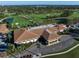 Expansive aerial view of club house, lush golf course and green scenery at 125 Belleview Blvd # 503, Belleair, FL 33756