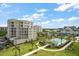 An aerial view of the building, community, and pool area at 125 Belleview Blvd # 503, Belleair, FL 33756