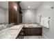 Bright bathroom with a granite countertop, a tub with chrome fixtures, and soft gray paint at 125 Belleview Blvd # 503, Belleair, FL 33756