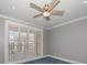 Bedroom features plantation shutters, a ceiling fan, and a view of the city at 125 Belleview Blvd # 503, Belleair, FL 33756