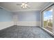Large bedroom with light blue walls, decorative molding, and a sliding door to a balcony with a view at 125 Belleview Blvd # 503, Belleair, FL 33756