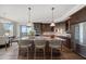 Kitchen with granite counters, stainless steel appliances, hardwood floors, and counter seating at 125 Belleview Blvd # 503, Belleair, FL 33756