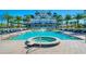 A beautiful community pool and hot tub are surrounded by lounge seating at 125 Belleview Blvd # 503, Belleair, FL 33756