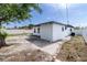 Spacious backyard featuring white fencing and a concrete patio area, ideal for outdoor relaxation and entertainment at 1328 Waikiki Way, Tampa, FL 33619