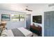 A well-lit bedroom with stylish furnishings including a wooden dresser and a comfortable bed at 1328 Waikiki Way, Tampa, FL 33619