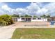 Charming single story home featuring a paver parking area and a fenced yard at 1328 Waikiki Way, Tampa, FL 33619