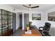 Well-lit home office features a modern desk, comfortable chair, and stylish storage, great for remote work at 1328 Waikiki Way, Tampa, FL 33619