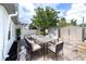 Outdoor patio with a large table and comfortable seating, ideal for dining and entertaining guests at 1328 Waikiki Way, Tampa, FL 33619