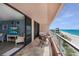 Relaxing balcony with seating area, offering spectacular views of the beach and ocean at 1340 Gulf Blvd # 16F, Clearwater, FL 33767