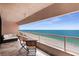Inviting balcony offers stunning ocean views, complete with seating, perfect for relaxation and enjoyment at 1340 Gulf Blvd # 16F, Clearwater, FL 33767