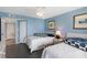 Comfortable bedroom with beachy decor, bright light, and two queen beds, inviting relaxation at 1340 Gulf Blvd # 16F, Clearwater, FL 33767