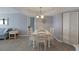 Inviting dining room with a white table, six chairs, and elegant lighting, perfect for entertaining at 1340 Gulf Blvd # 16F, Clearwater, FL 33767