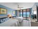 Serene main bedroom with ocean views from the sliding glass doors, creating a tranquil retreat at 1340 Gulf Blvd # 16F, Clearwater, FL 33767