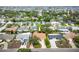 A clear aerial view of a charming residence featuring a well-maintained exterior and surrounding greenery at 1370 Hill Dr, Largo, FL 33770