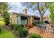 Backyard featuring an outdoor seating area surrounded by lush landscaping at 1370 Hill Dr, Largo, FL 33770