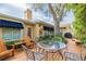 Backyard deck features outdoor seating, and a mature shade tree at 1370 Hill Dr, Largo, FL 33770