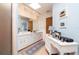 Bathroom featuring a long vanity with dual sinks and a makeup table at 1370 Hill Dr, Largo, FL 33770