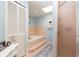 Well-lit bathroom featuring a soaking tub and walk-in shower at 1370 Hill Dr, Largo, FL 33770