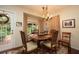 Bright dining room with a chandelier, natural light, and a view of the backyard at 1370 Hill Dr, Largo, FL 33770