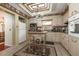Bright kitchen with tile floors, ample counter space, a center island and a view to dining area at 1370 Hill Dr, Largo, FL 33770