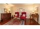 Cozy seating area with plush armchairs, decorative accents, and a stylish area rug on hardwood floors at 1370 Hill Dr, Largo, FL 33770