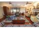Cozy living room features a large window, ceiling fans, hardwood floors, and traditional furnishings at 1370 Hill Dr, Largo, FL 33770