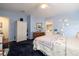 Spacious primary bedroom with plush carpeting, traditional furnishings, and plenty of natural light at 1370 Hill Dr, Largo, FL 33770