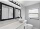 Modern bathroom featuring dual mirrors, updated vanity, updated light fixture and a great sink bowl design at 1586 Linwood Dr, Clearwater, FL 33755
